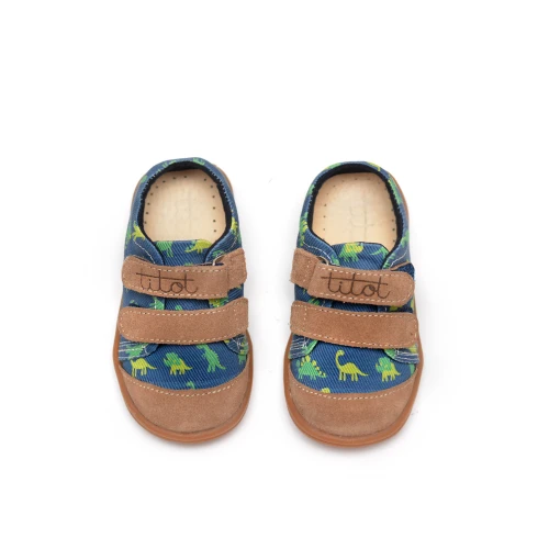 Widok z góry na parę granatowych butów dziecięcych Navy Dino z widocznym grawerowanym logo na skórzanych rzepach.